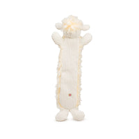 HuggleHounds Louise Lamb Fluffer Toy being carried by a dog, showing the 16-inch plush toy's floppy ears and soft texture.
