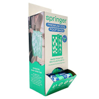 Springland single poop bag roll showing detailed view of perforated tear lines and bag thickness.