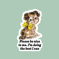 Sticker of a dog with a yellow bow and text 'Please be nice to me. I'm doing the best I can' on a pixelated background.