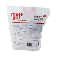 Close-up detail of MuttGut Raw Saddle Bones treat texture and natural bone surface.