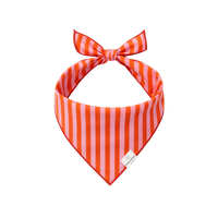 rufflifepals dog bandana in bold orange and pink stripes, shown as a flat product lay.