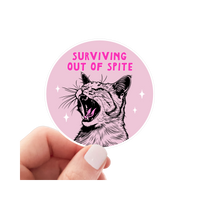Yarnival Surviving Out of Spite sticker featuring bold typography on a white vinyl background.