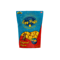 Wild Meadow Farms Egg Puffs dog treats displayed in their retail packaging on a clean background.