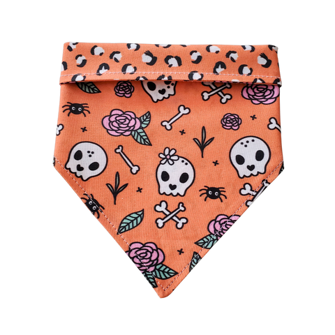 Charlie & the Hound Skull & Roses Reversible Dog Bandana displayed flat showing both skull and floral sides.