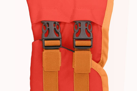 Dog wearing red Ruffwear Float Coat life jacket while swimming in water, demonstrating proper fit and buoyancy.